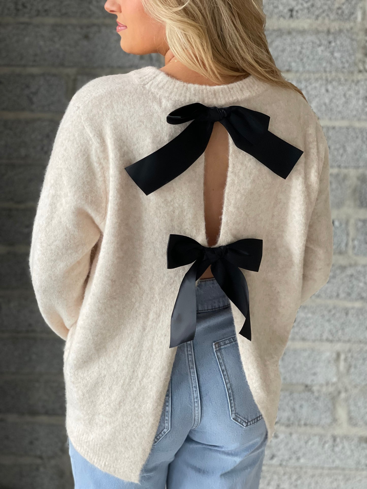 Amelia ivory jumper with reverse black bow