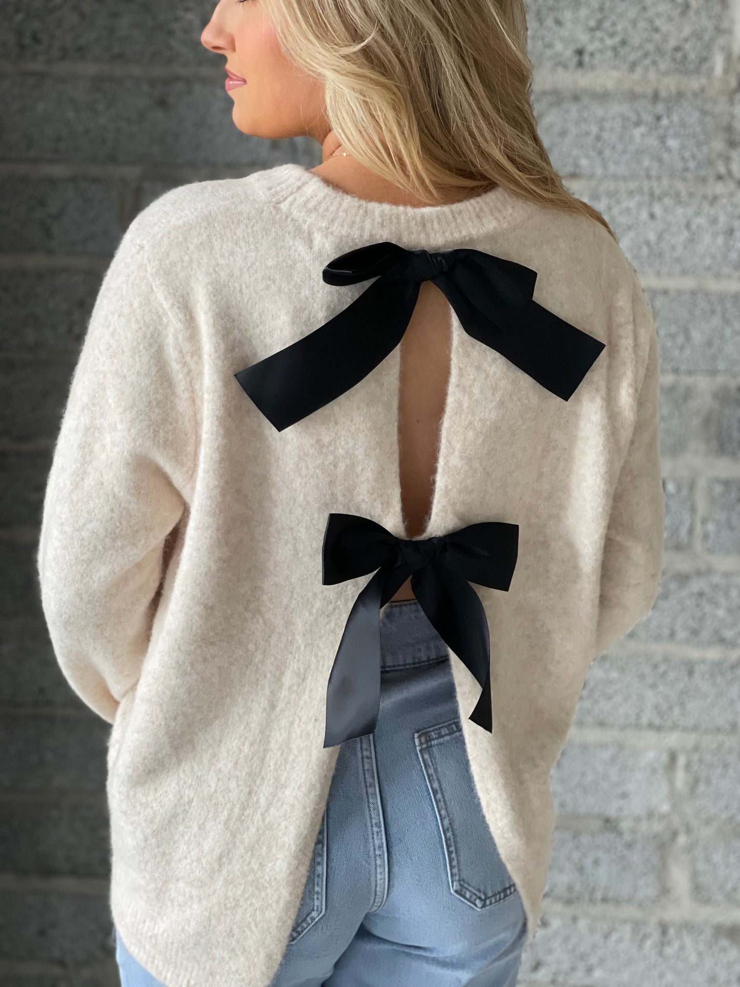 Amelia ivory jumper with reverse black bow