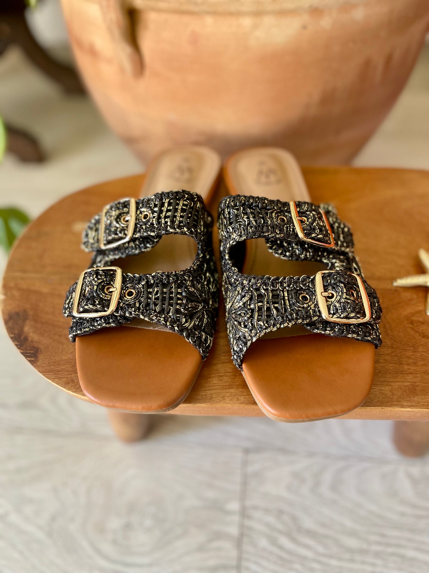 Black speckled flat sandals with buckles
