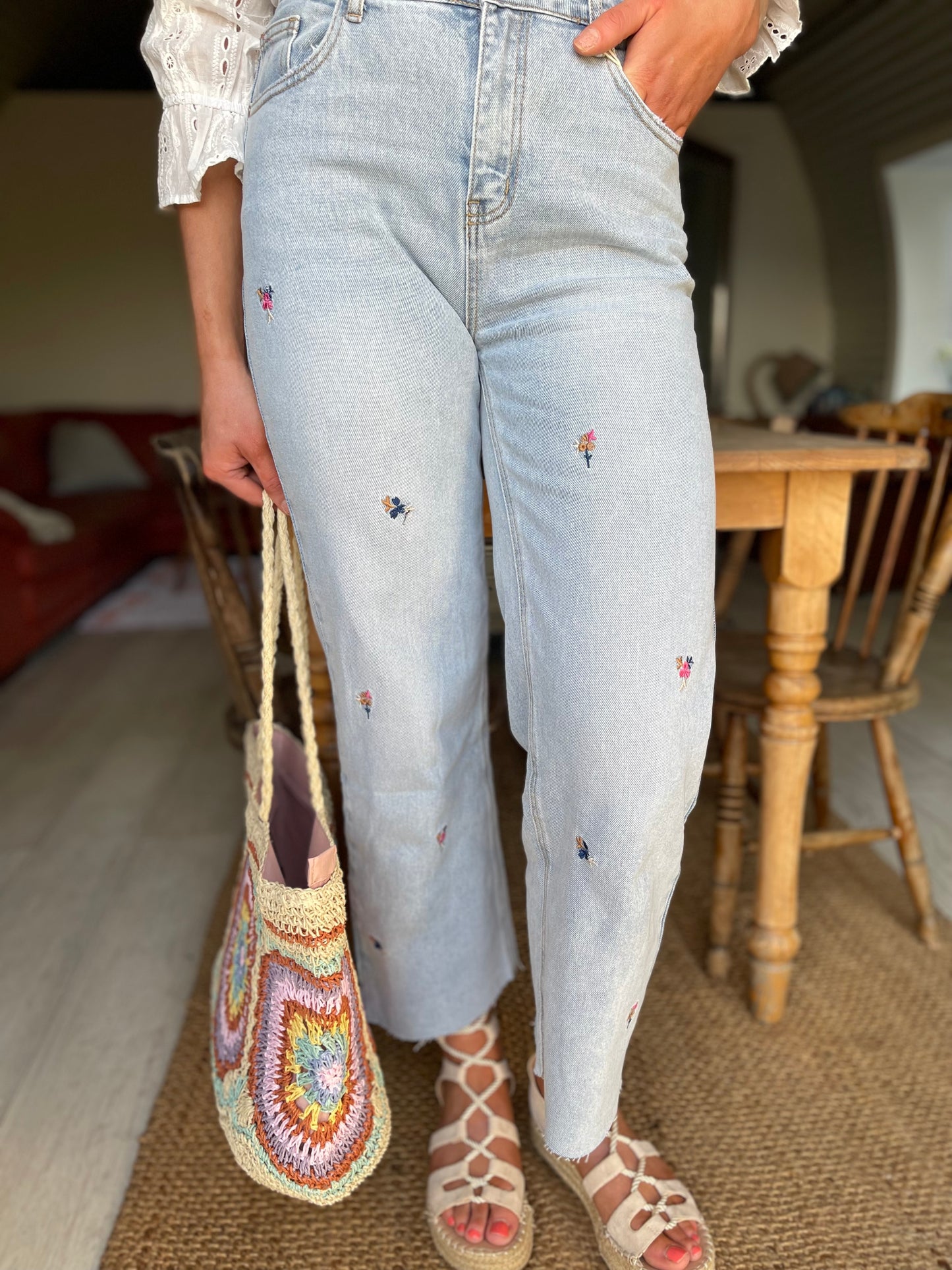 Floral embroidered light wash wide/straight leg jeans