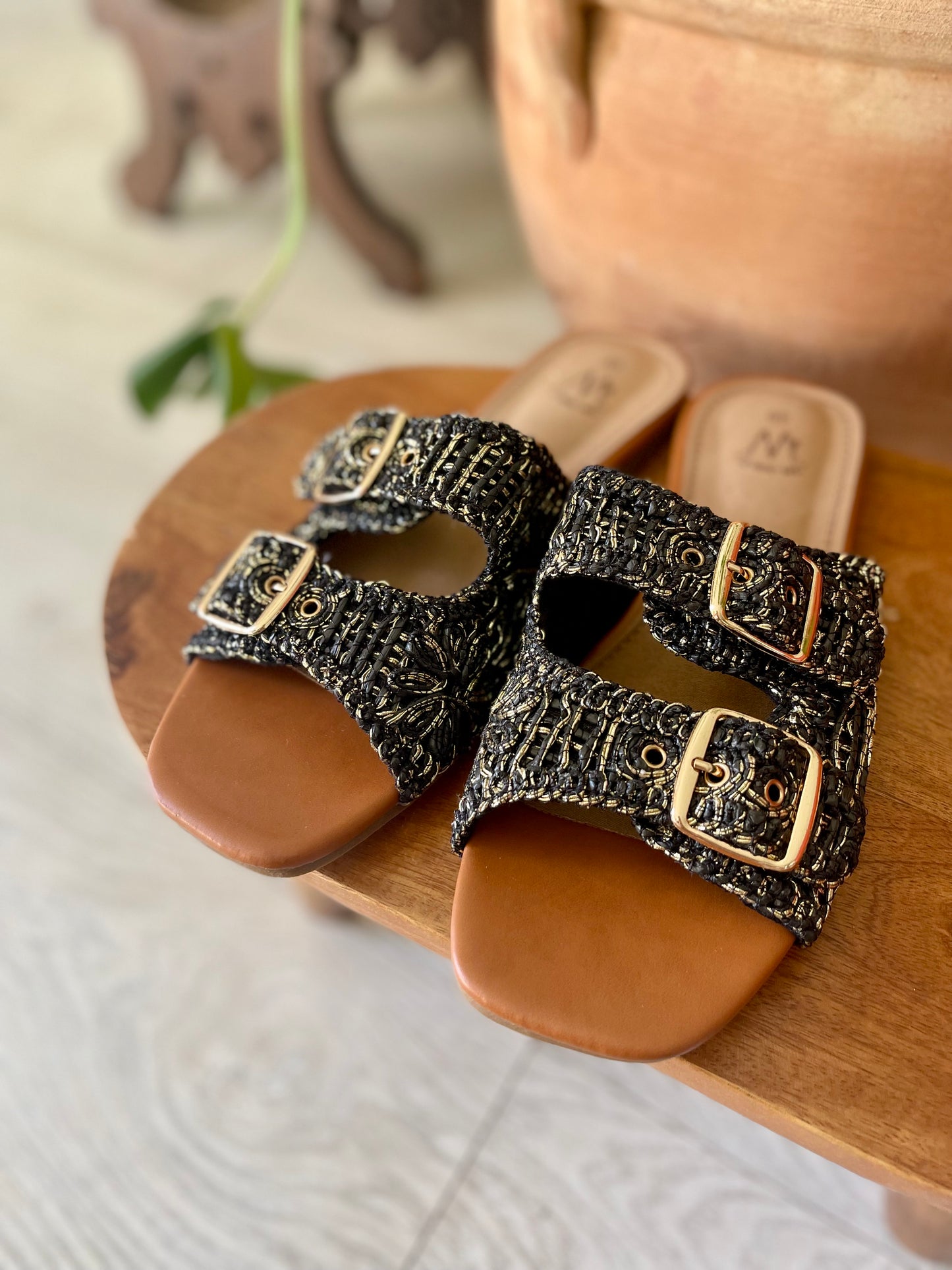 Black speckled flat sandals with buckles
