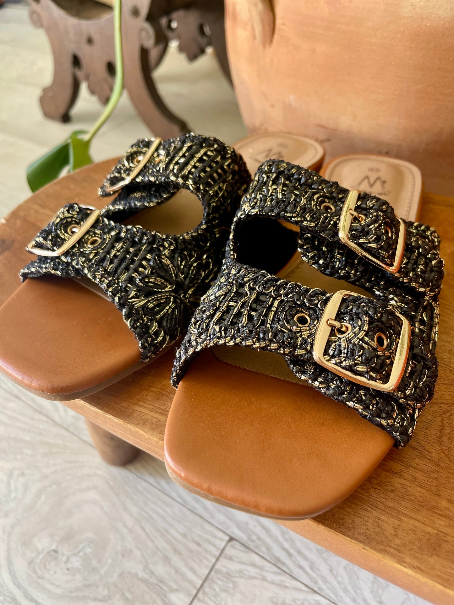 Black speckled flat sandals with buckles