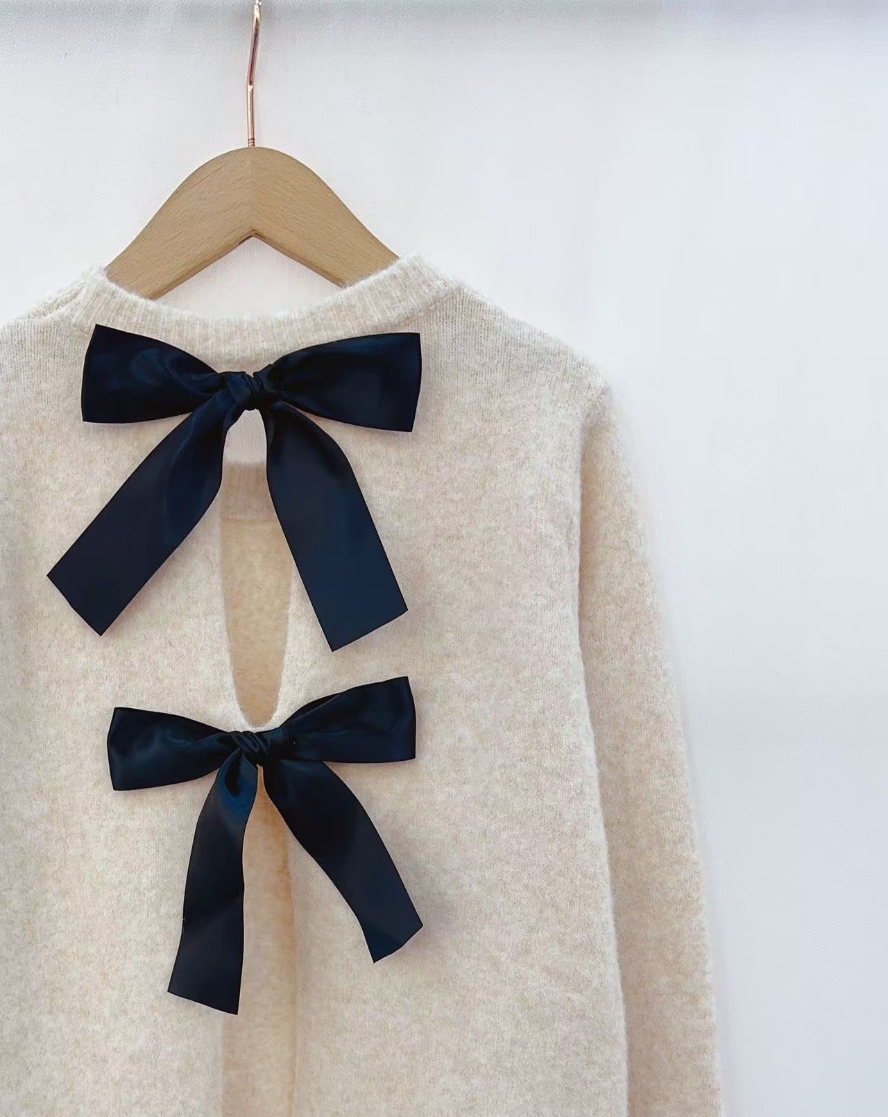Amelia ivory jumper with reverse black bow