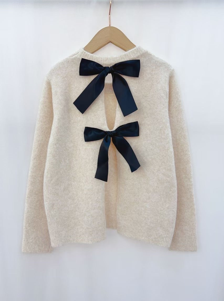 Amelia ivory jumper with reverse black bow
