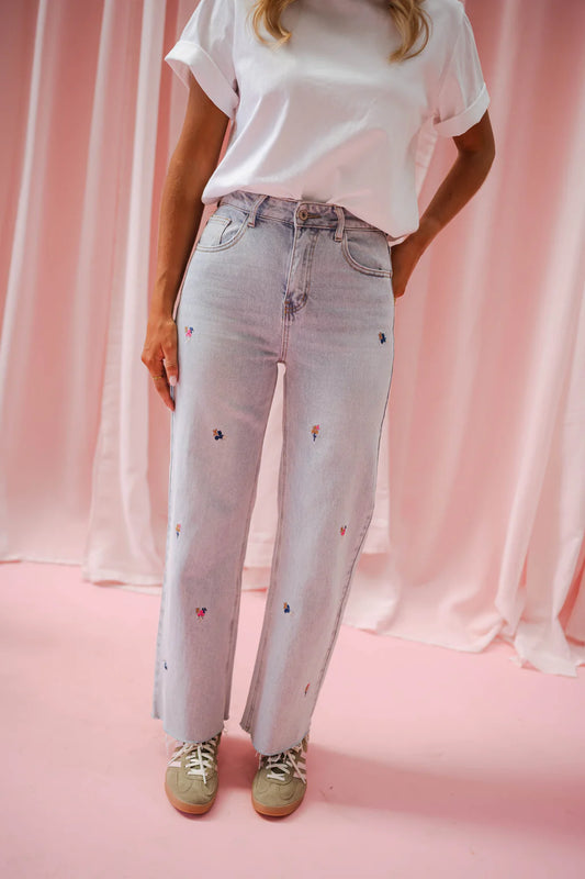 Floral embroidered light wash wide/straight leg jeans