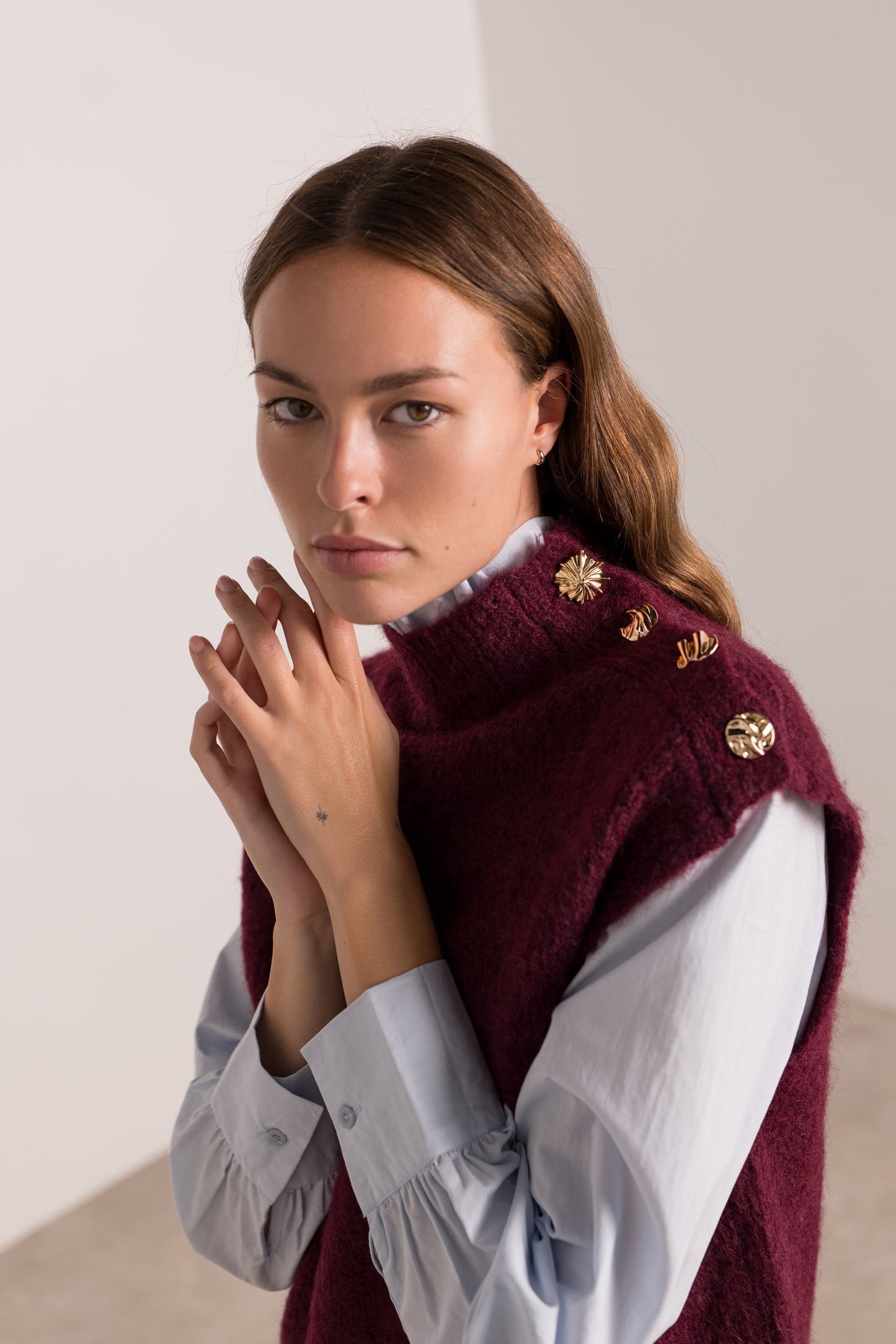 Sophia burgundy sleeveless jumper with gold buttons