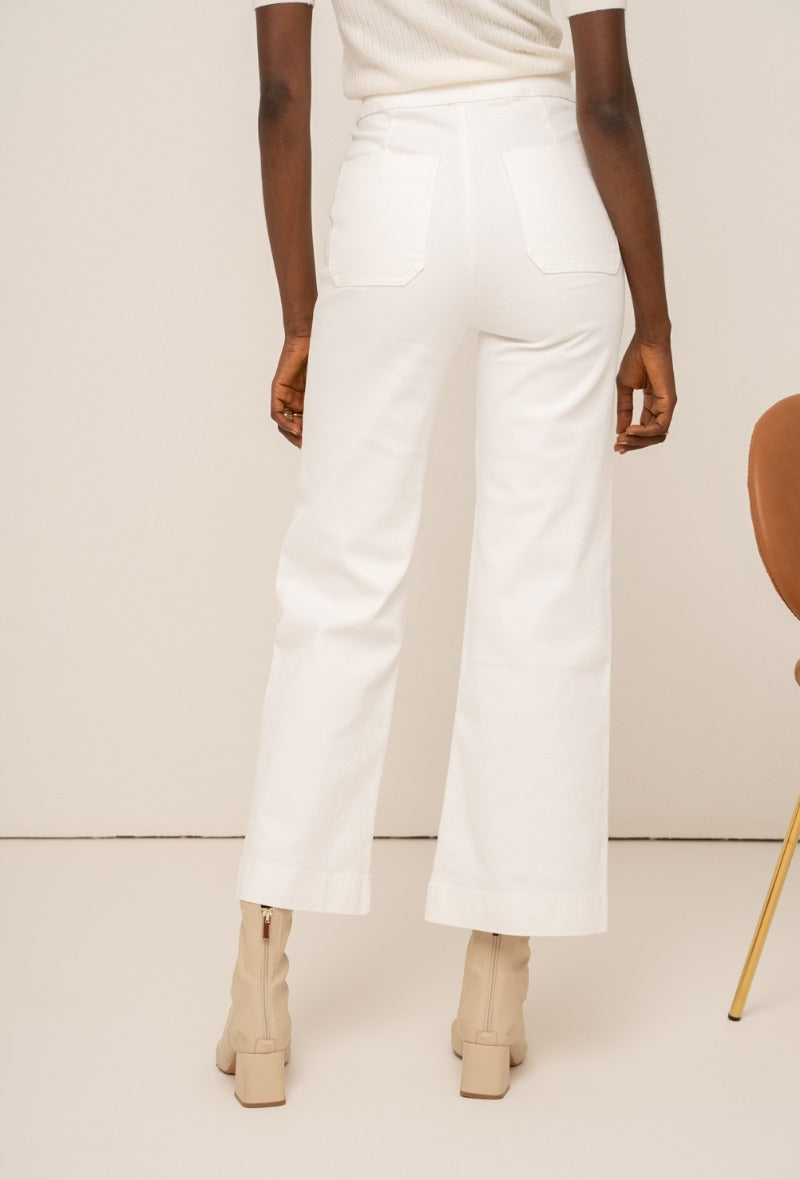 Wide leg white jeans with gold buttons