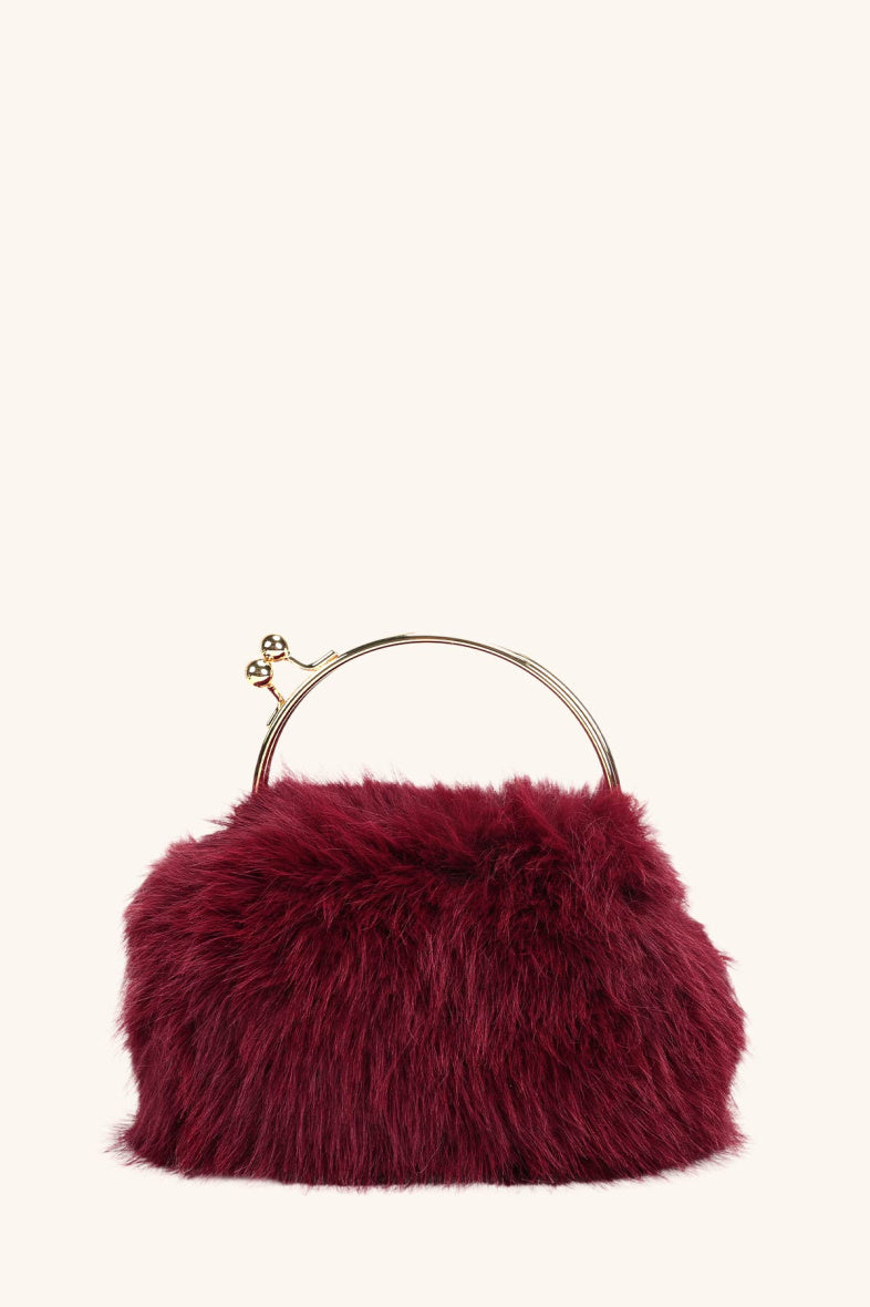 Burgundy faux fur gold handle clutch bag