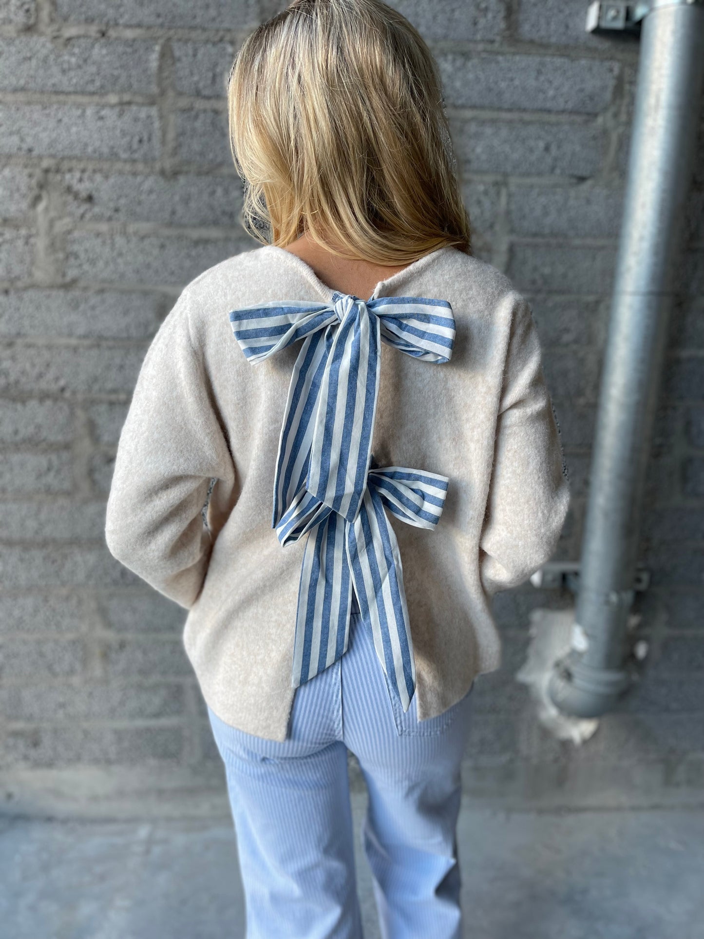 Erin beige jumper with striped bow back detail