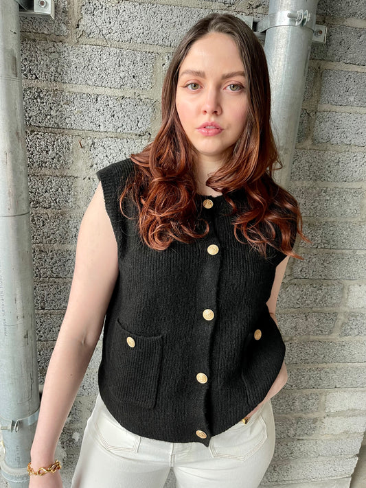 Cara fluffy black waistcoat with gold buttons