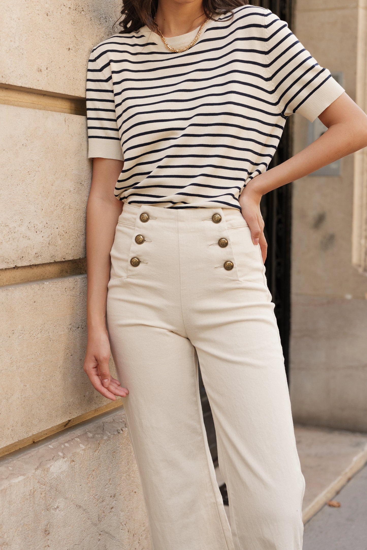 Cream wide leg jeans with front gold buttons