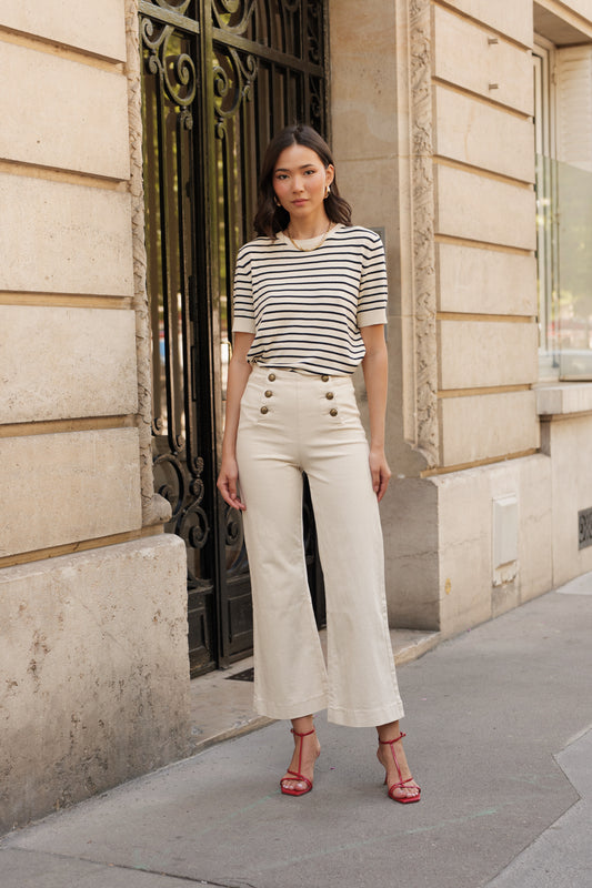 Cream wide leg jeans with front gold buttons