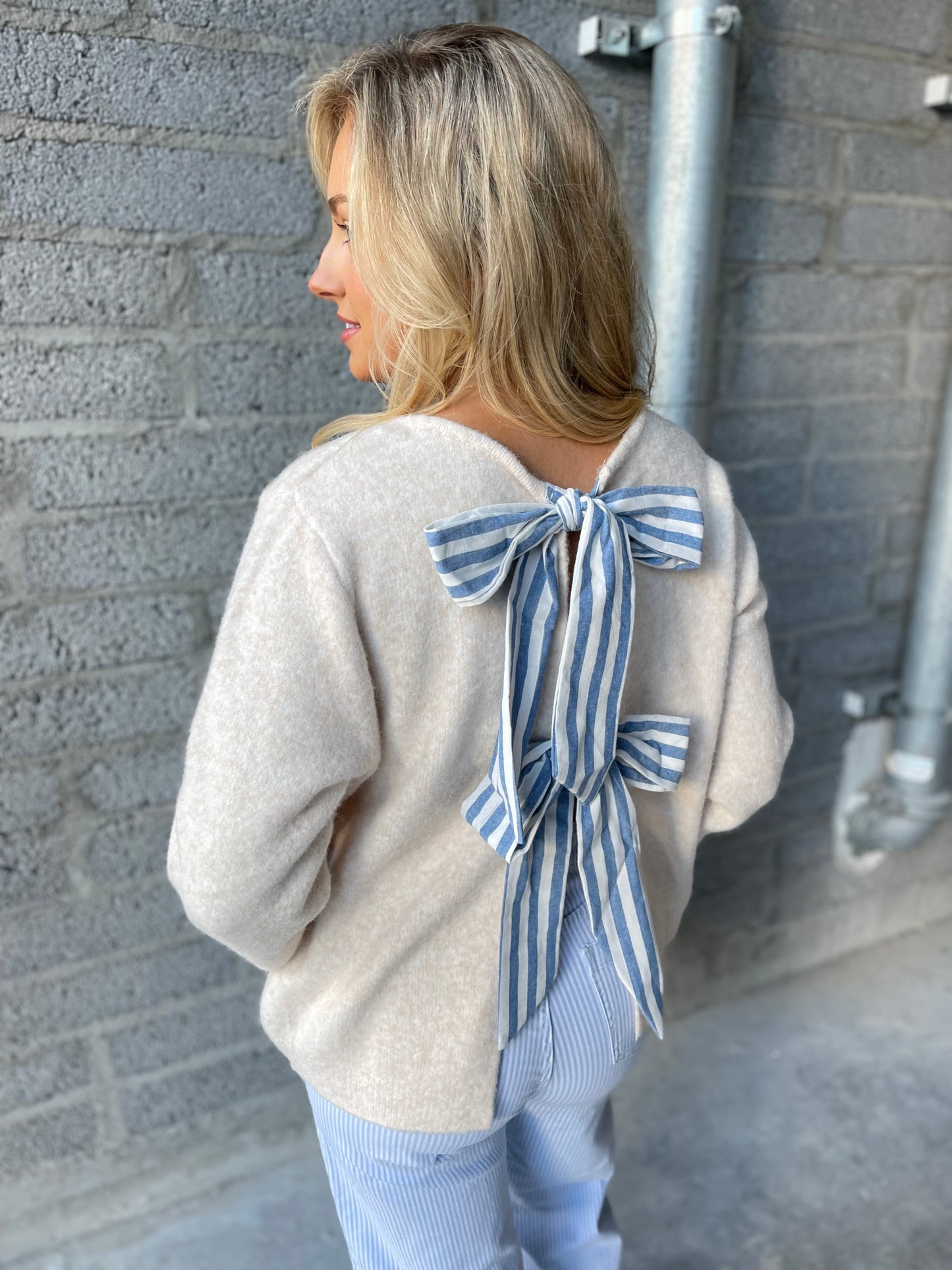 Erin beige jumper with striped bow back detail