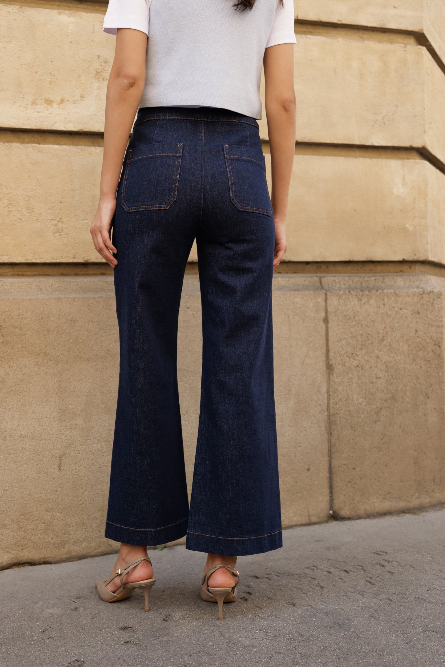 Navy blue wide leg jeans with front gold buttons