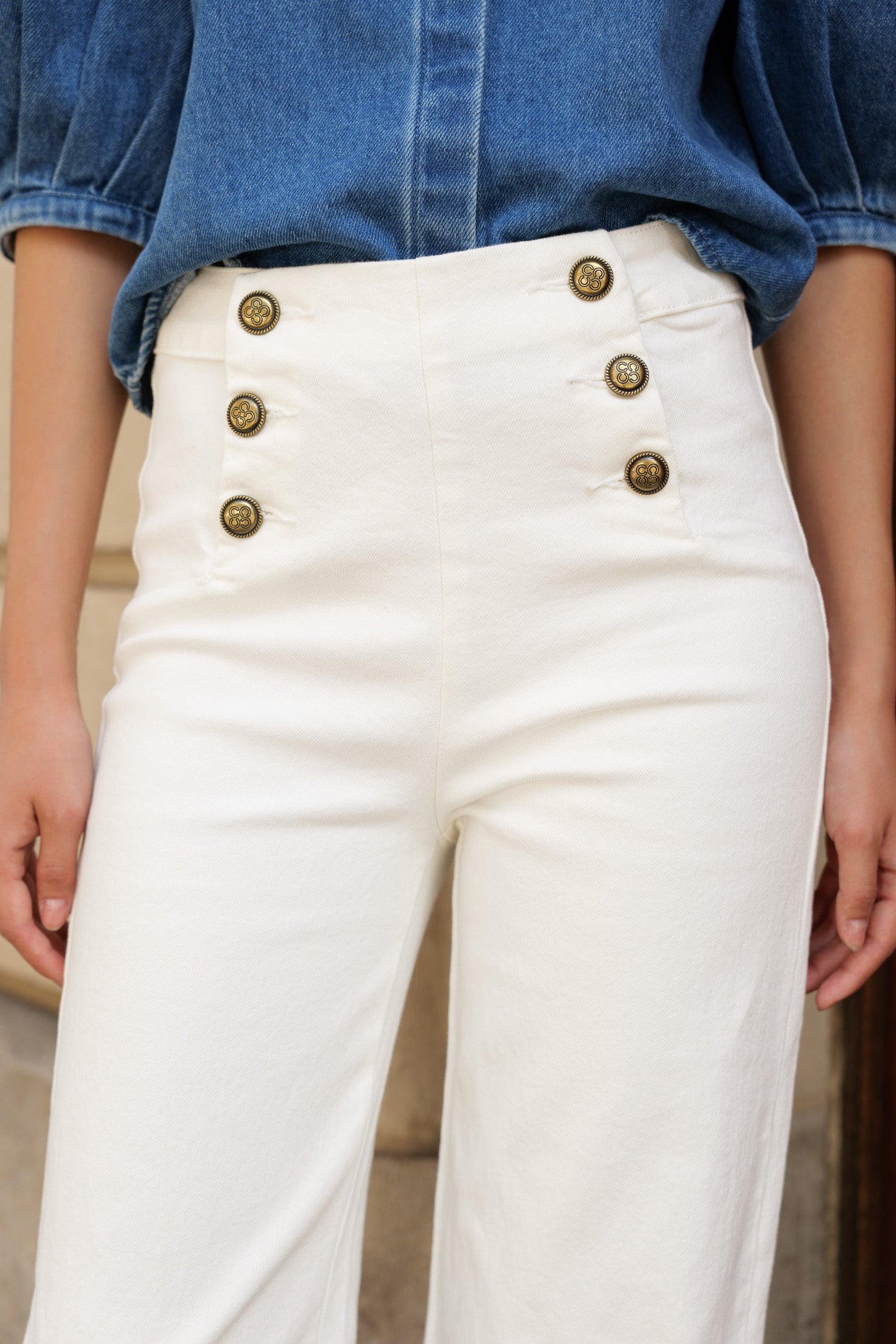 Wide leg white jeans with gold buttons
