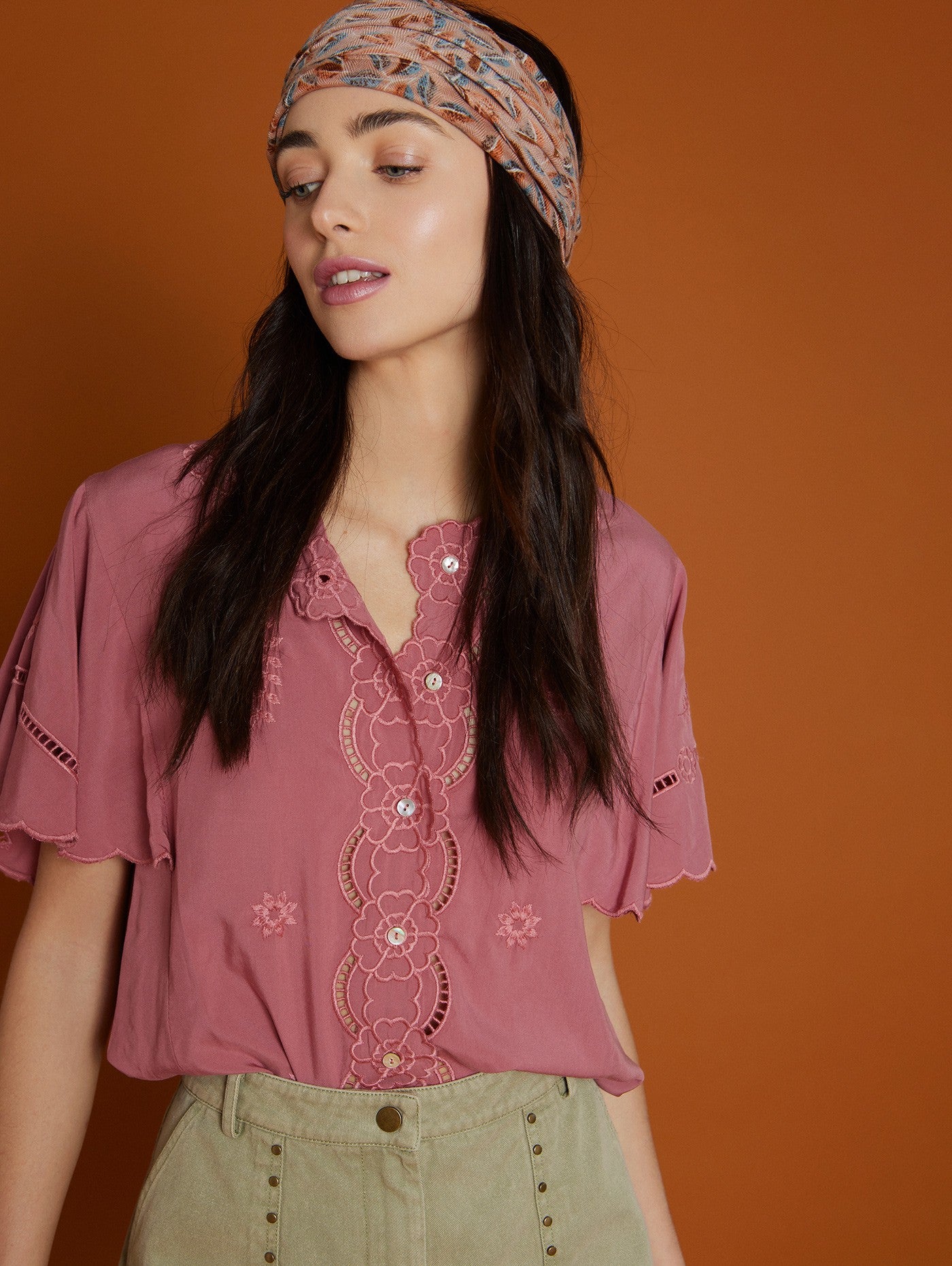 Embroidered cut out pink blouse