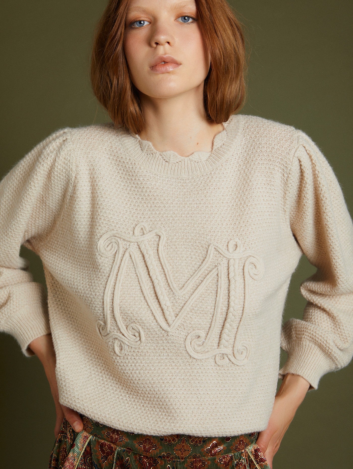 Embossed letter sweater