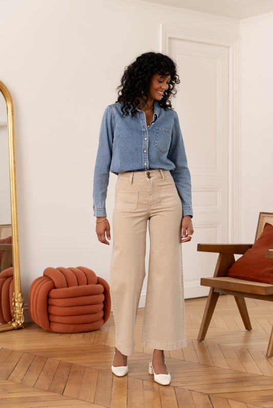 Beige wide leg jeans with two gold buttons