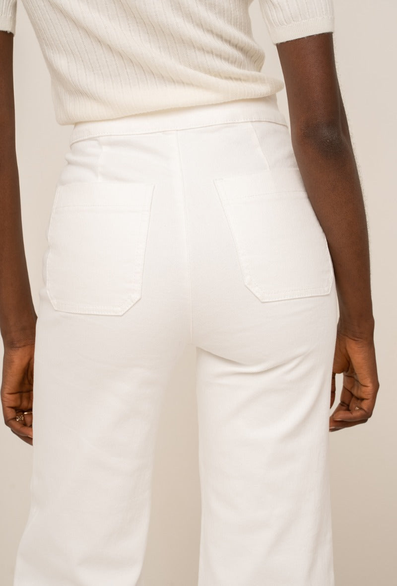 Wide leg white jeans with gold buttons